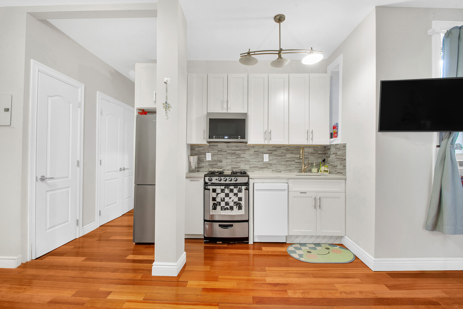 255 79th Street, Unit A7 Brooklyn, NY 11209 - Photo 1 of 7 a view of kitchen with granite countertop stove top oven and refrigerator