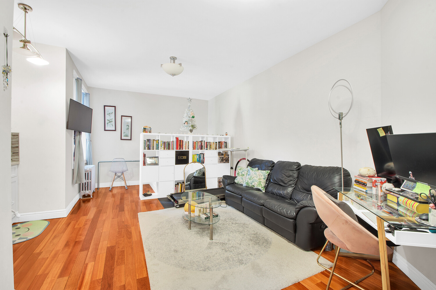 255 79th Street, Unit A7 Brooklyn, NY 11209 - Photo 2 of 7 a living room with furniture and a flat screen tv