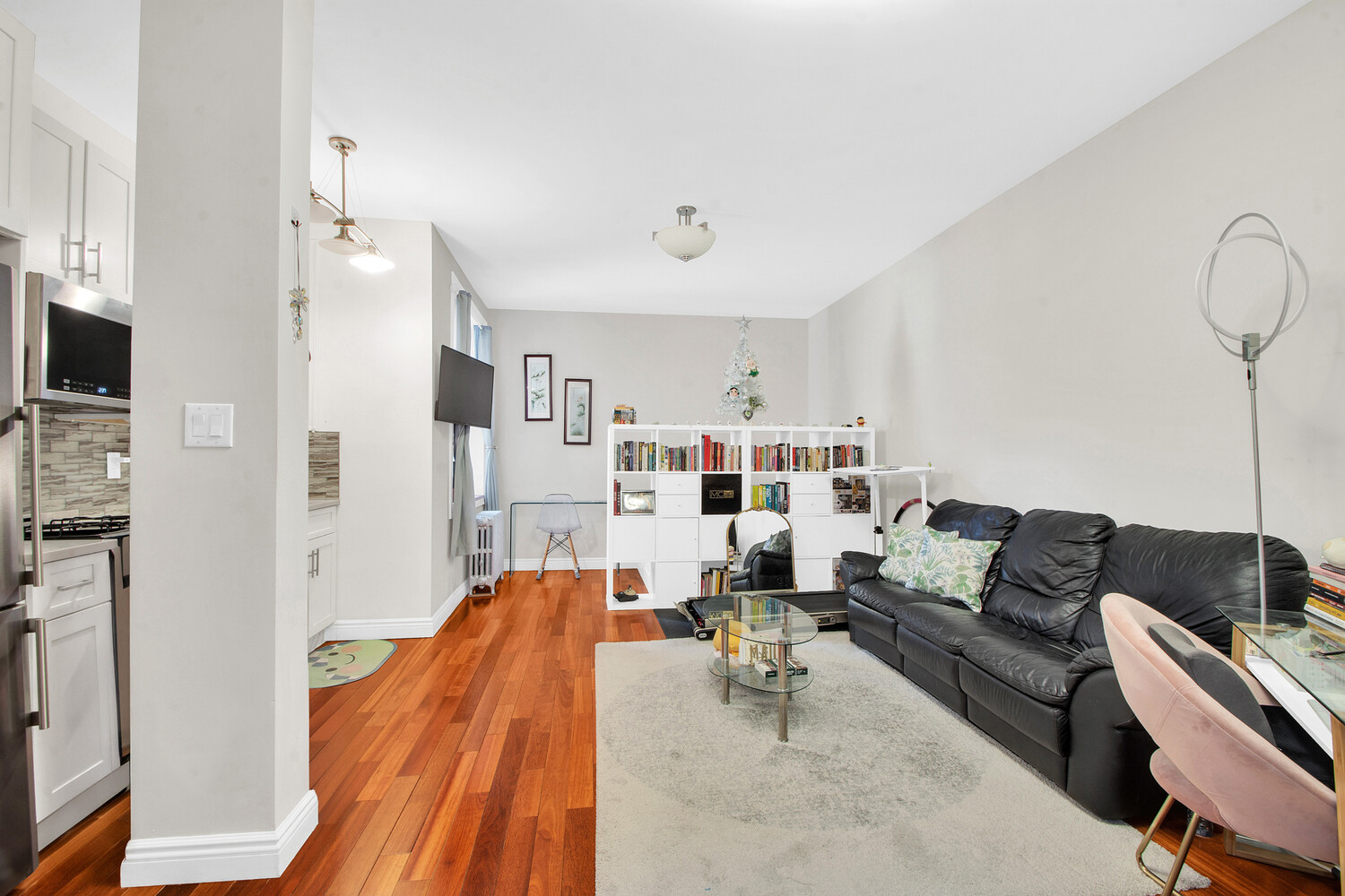 255 79th Street, Unit A7 Brooklyn, NY 11209 - Photo 4 of 7 a living room with furniture and a flat screen tv