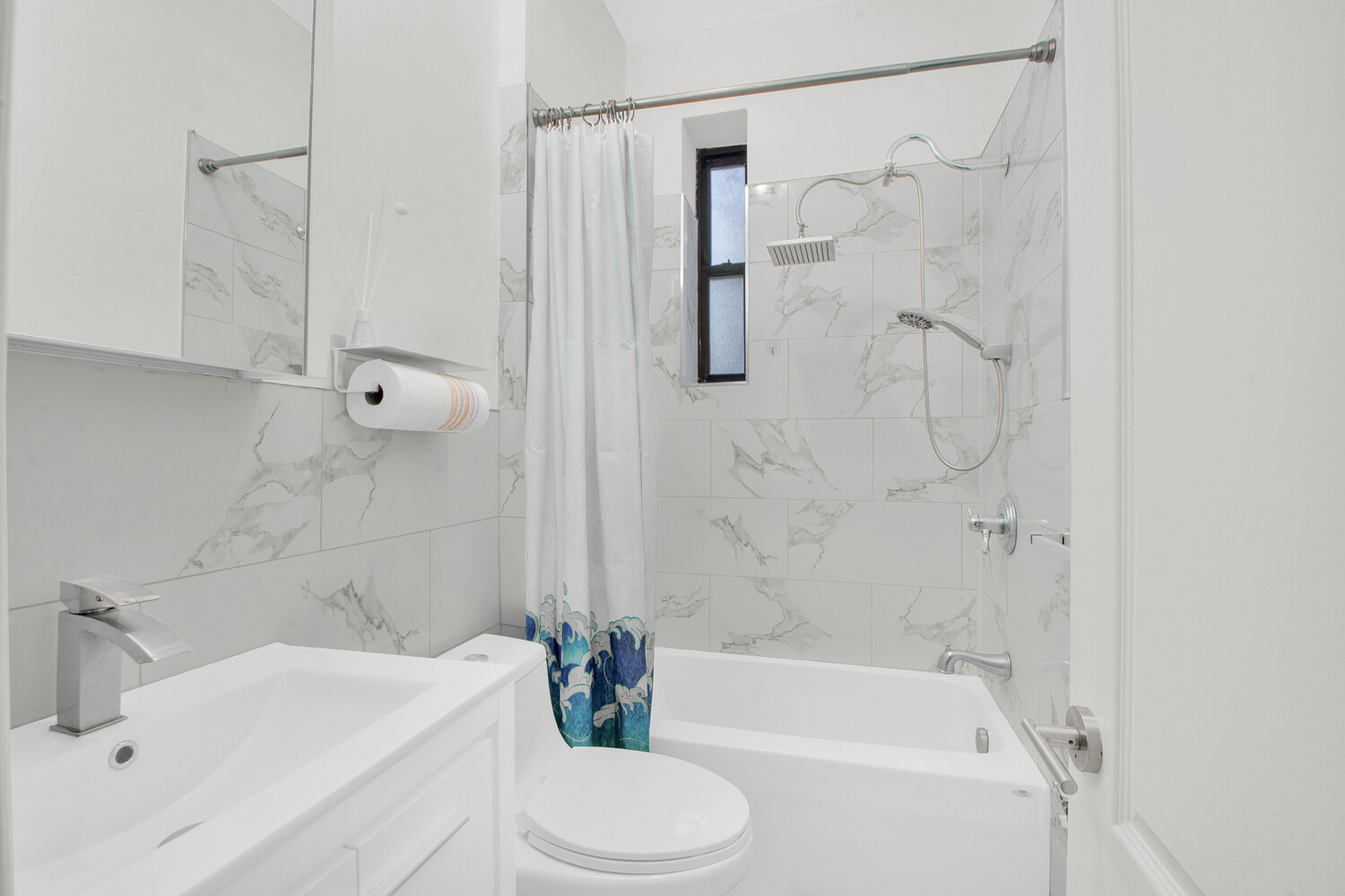 255 79th Street, Unit A7 Brooklyn, NY 11209 - Photo 6 of 7 a bathroom with a sink toilet and shower