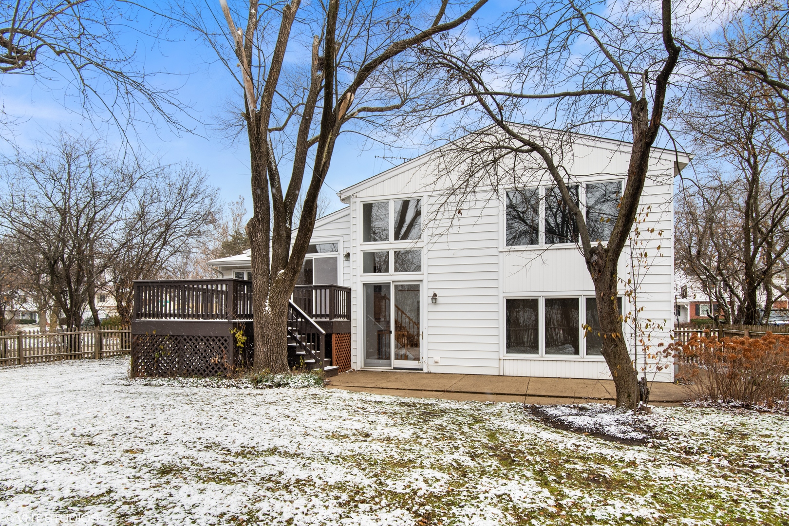 36 Forestway Drive Deerfield, IL 60015 - Photo 2 of 37 a backyard of a house with wooden fence and large trees