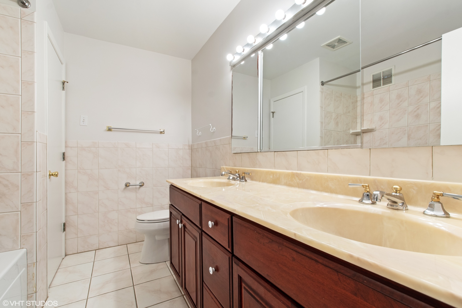 36 Forestway Drive Deerfield, IL 60015 - Photo 24 of 37 a bathroom with a sink a toilet and shower