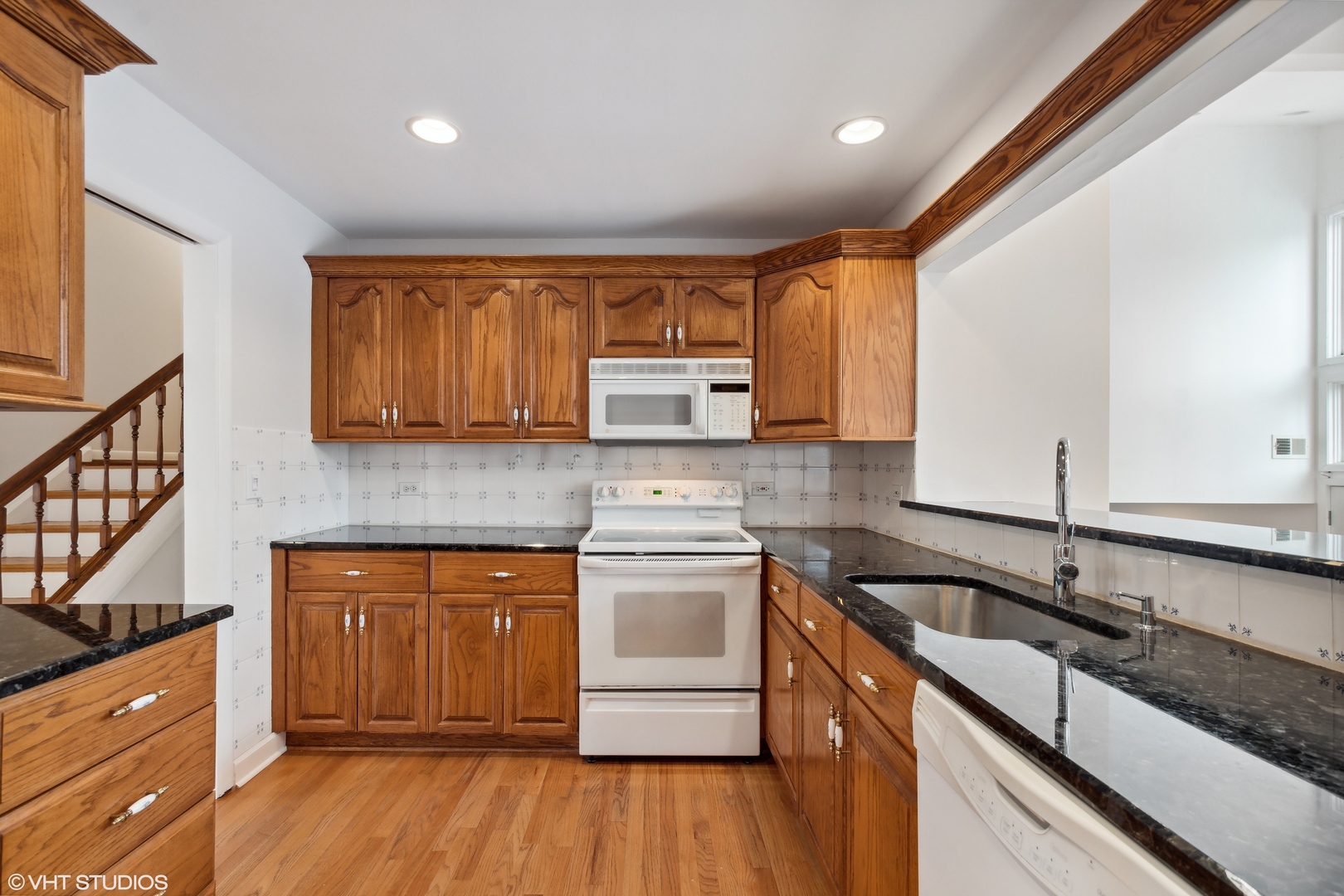 36 Forestway Drive Deerfield, IL 60015 - Photo 10 of 37 a kitchen with stainless steel appliances granite countertop wooden cabinets stove top oven and sink