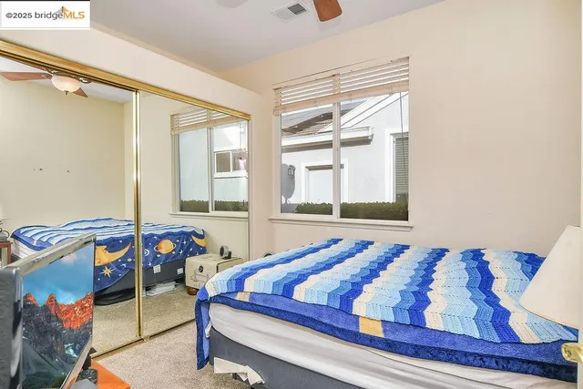 a kitchen with stainless steel appliances a stove cabinets and a refrigerator