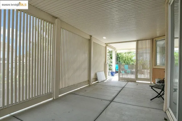 a outdoor space with patio the couch and glass door