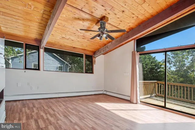 a view of a room with wooden floor and iron walls