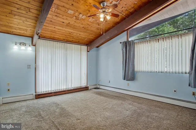 an empty room with windows