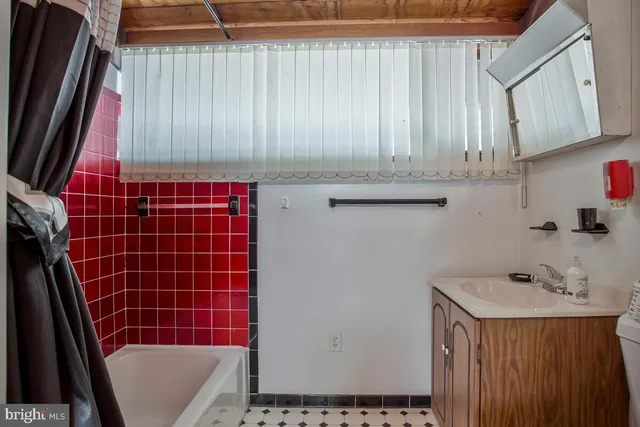 a view of a porch with a door and wooden floor