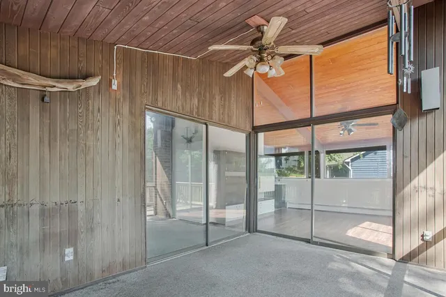 a view of an empty room with a glass door