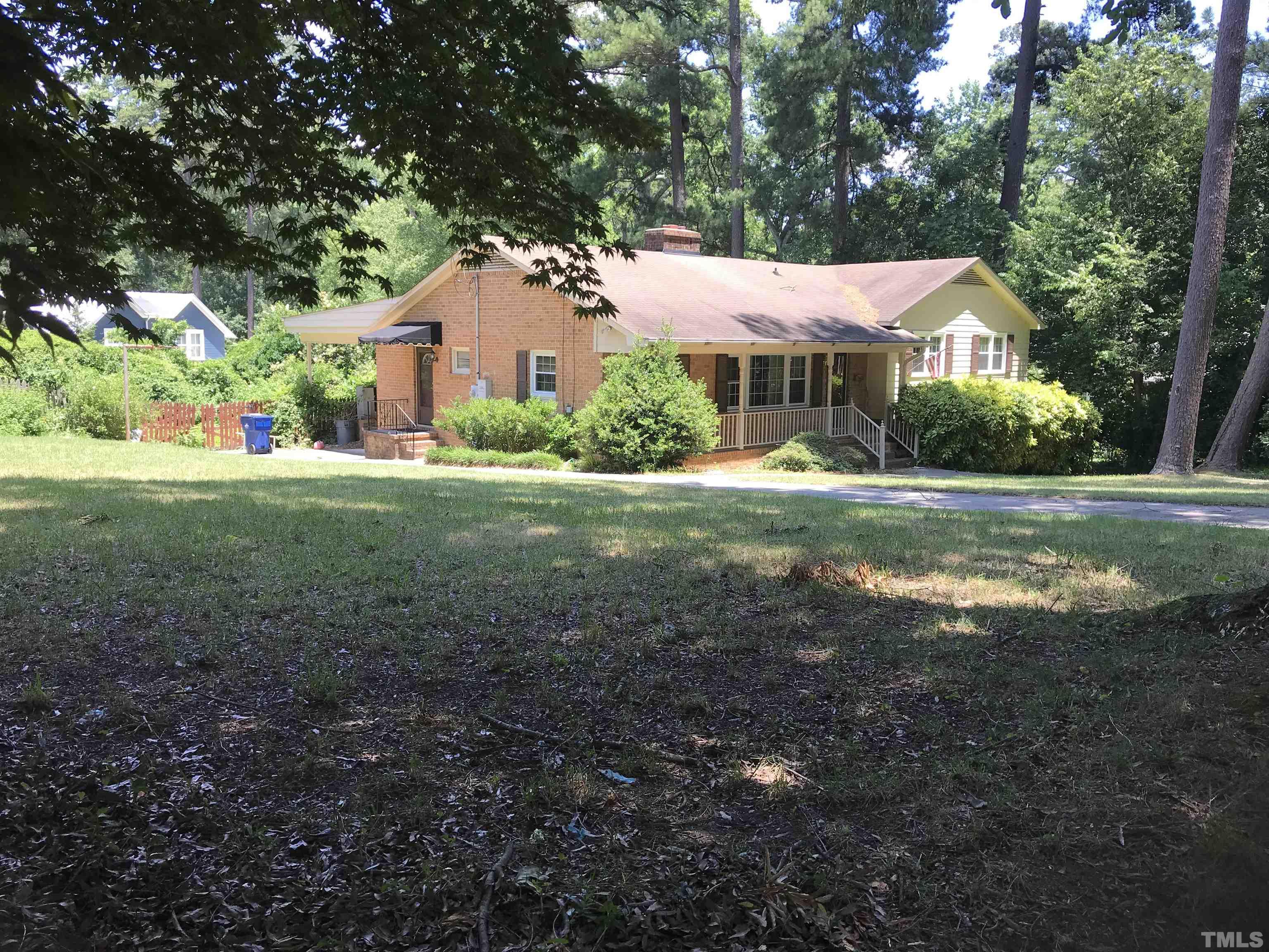 2736 Rosedale Avenue Raleigh, NC 27607 - Photo 1 of 12 a front view of a house with a yard and garage