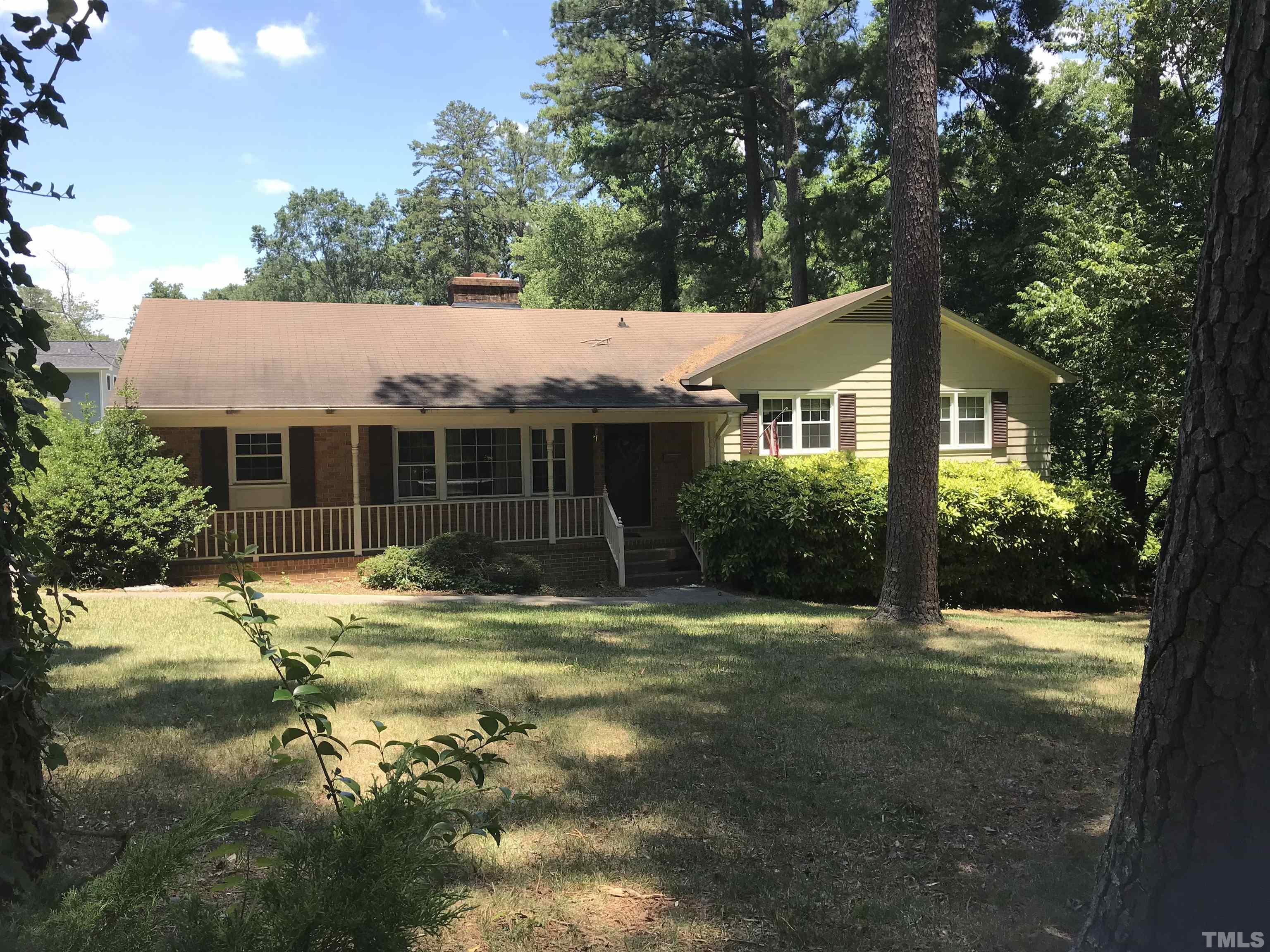 2736 Rosedale Avenue Raleigh, NC 27607 - Photo 2 of 12 a backyard of a house with yard and outdoor seating