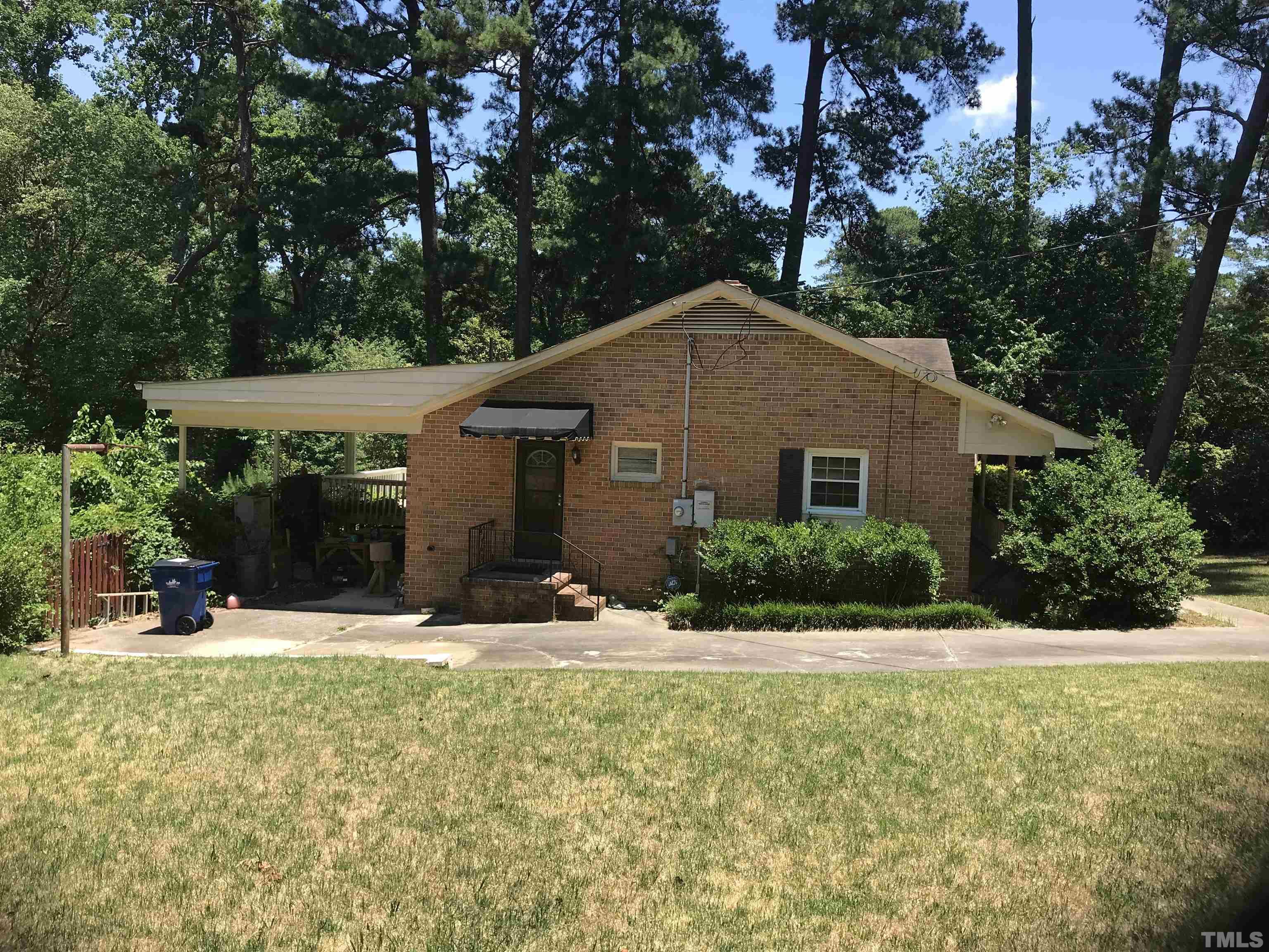 2736 Rosedale Avenue Raleigh, NC 27607 - Photo 3 of 12 a front view of a house with a yard