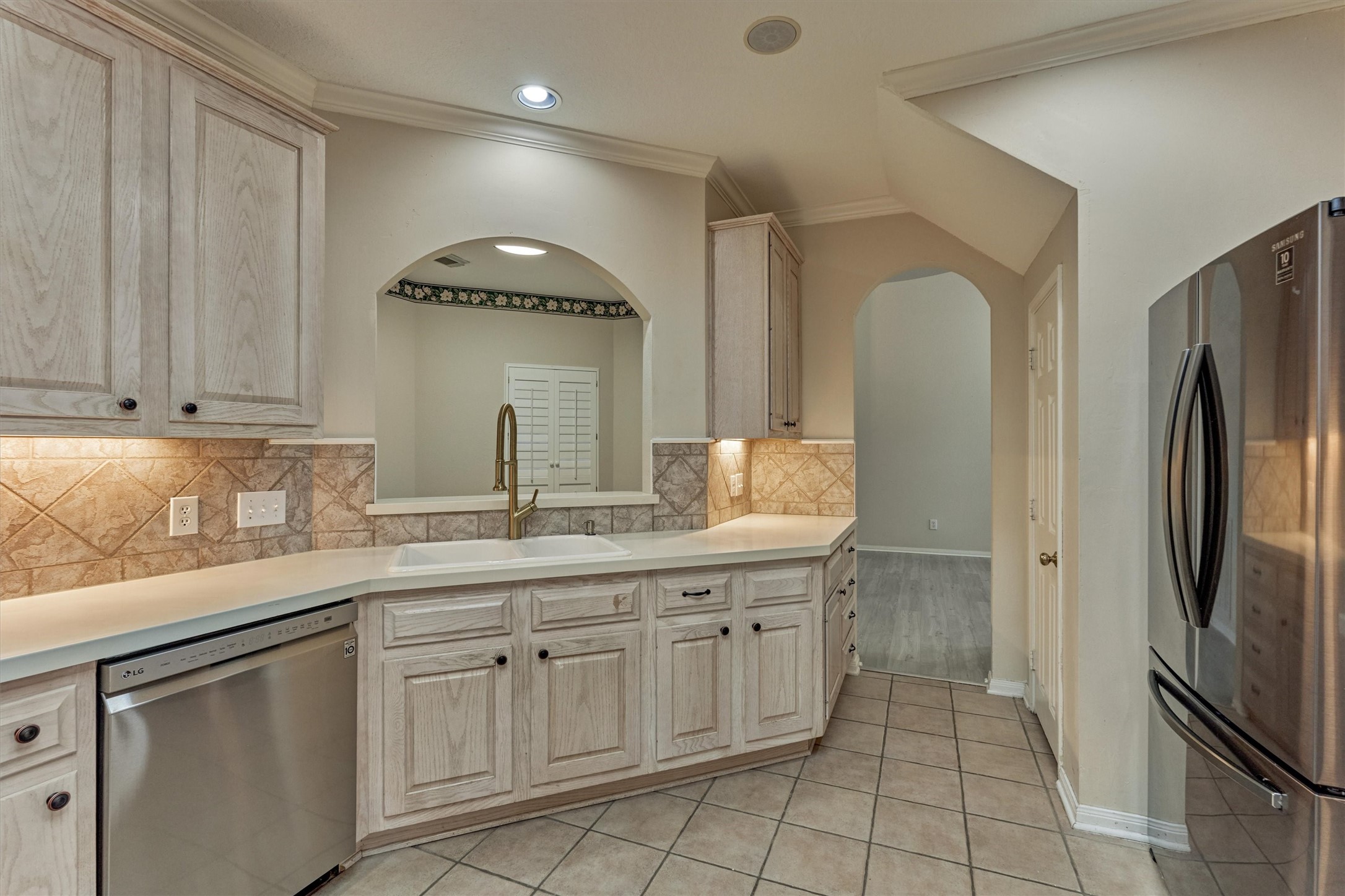 14420 Walters Road, Unit 26 Houston, TX 77014 - Photo 18 of 45 a kitchen with a sink stainless steel appliances and cabinets