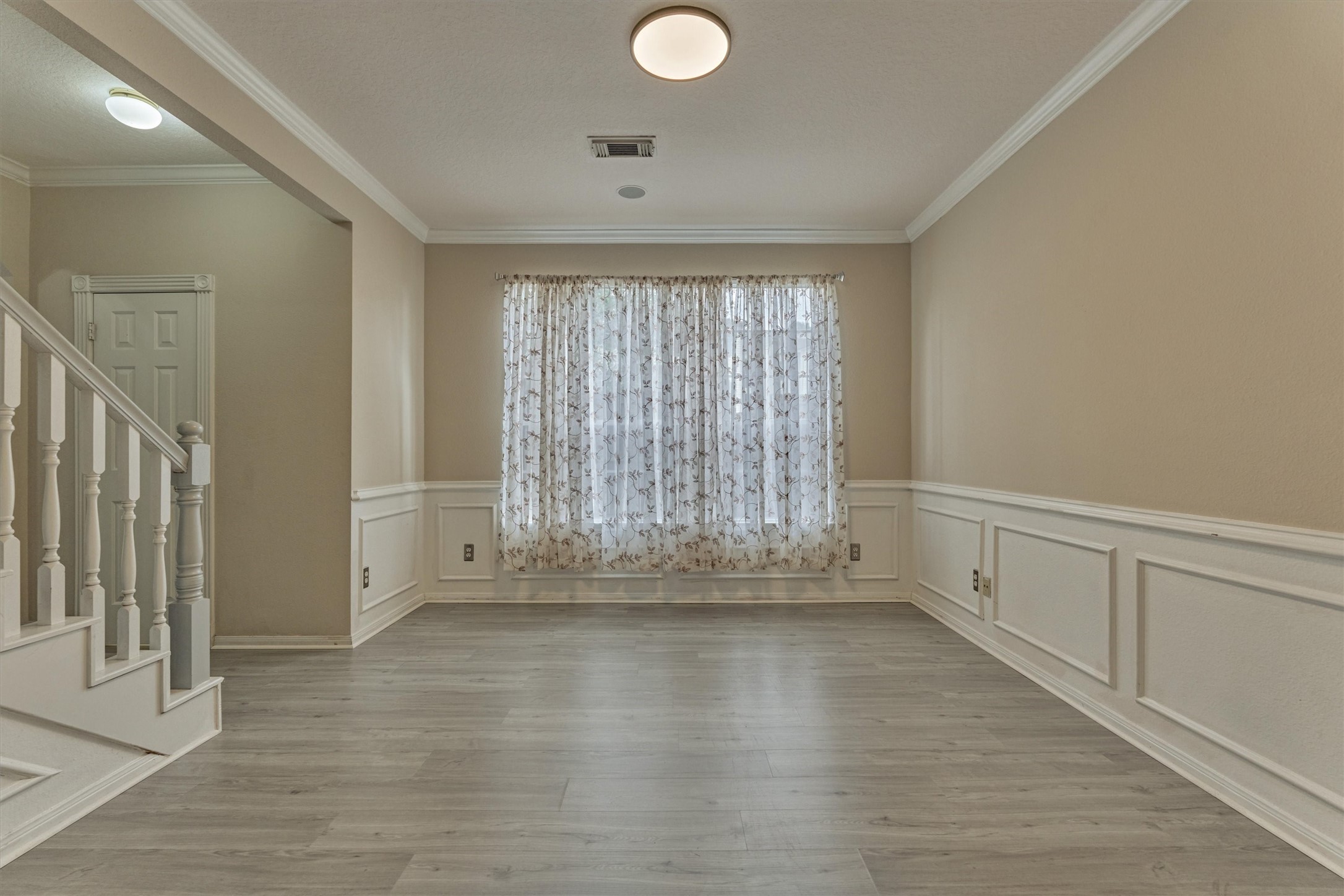 14420 Walters Road, Unit 26 Houston, TX 77014 - Photo 19 of 45 a view of an empty room with wooden floor and a window