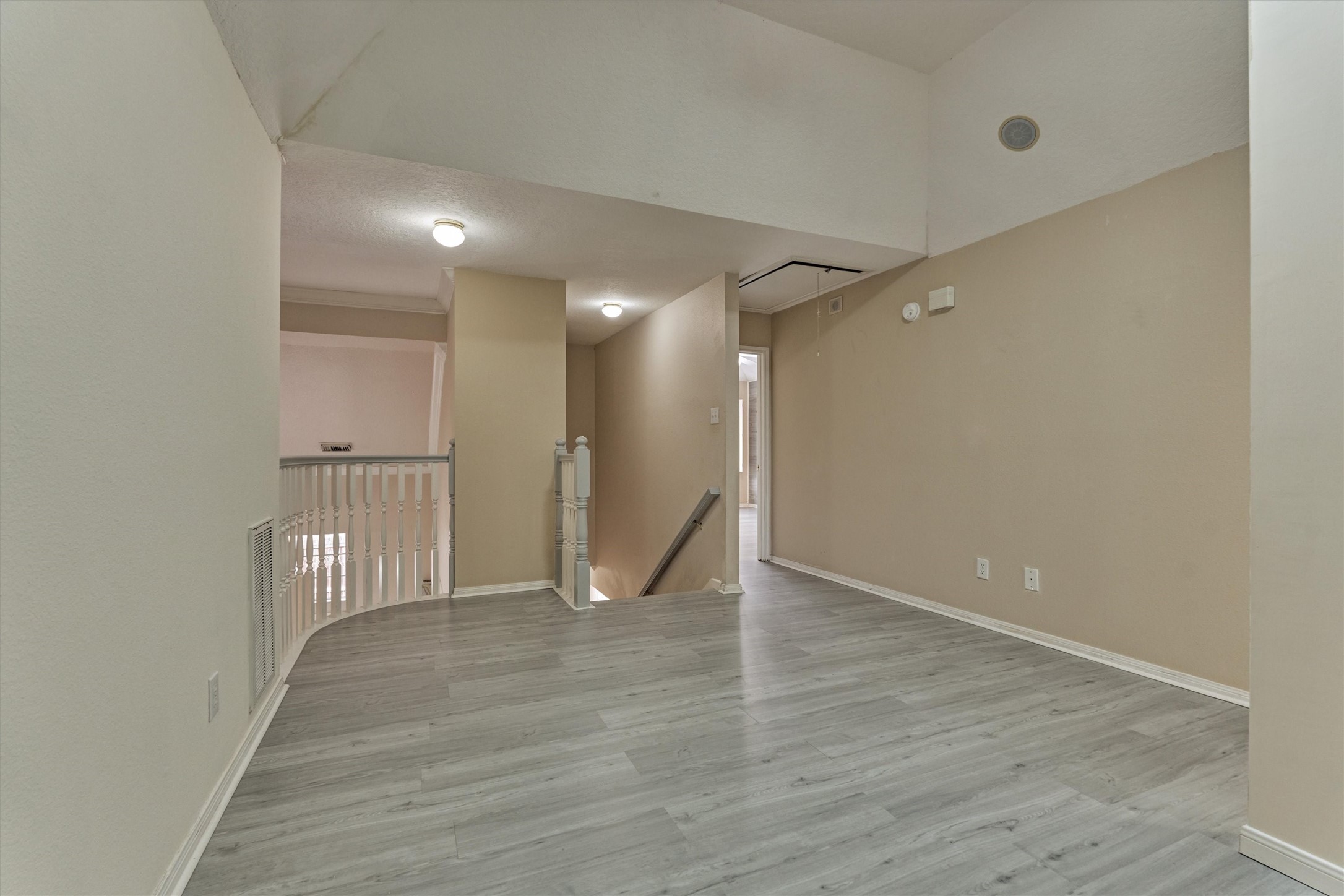 14420 Walters Road, Unit 26 Houston, TX 77014 - Photo 26 of 45 a view of an empty room with wooden floor