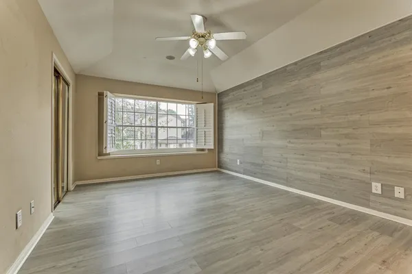 a view of a swimming pool with a yard