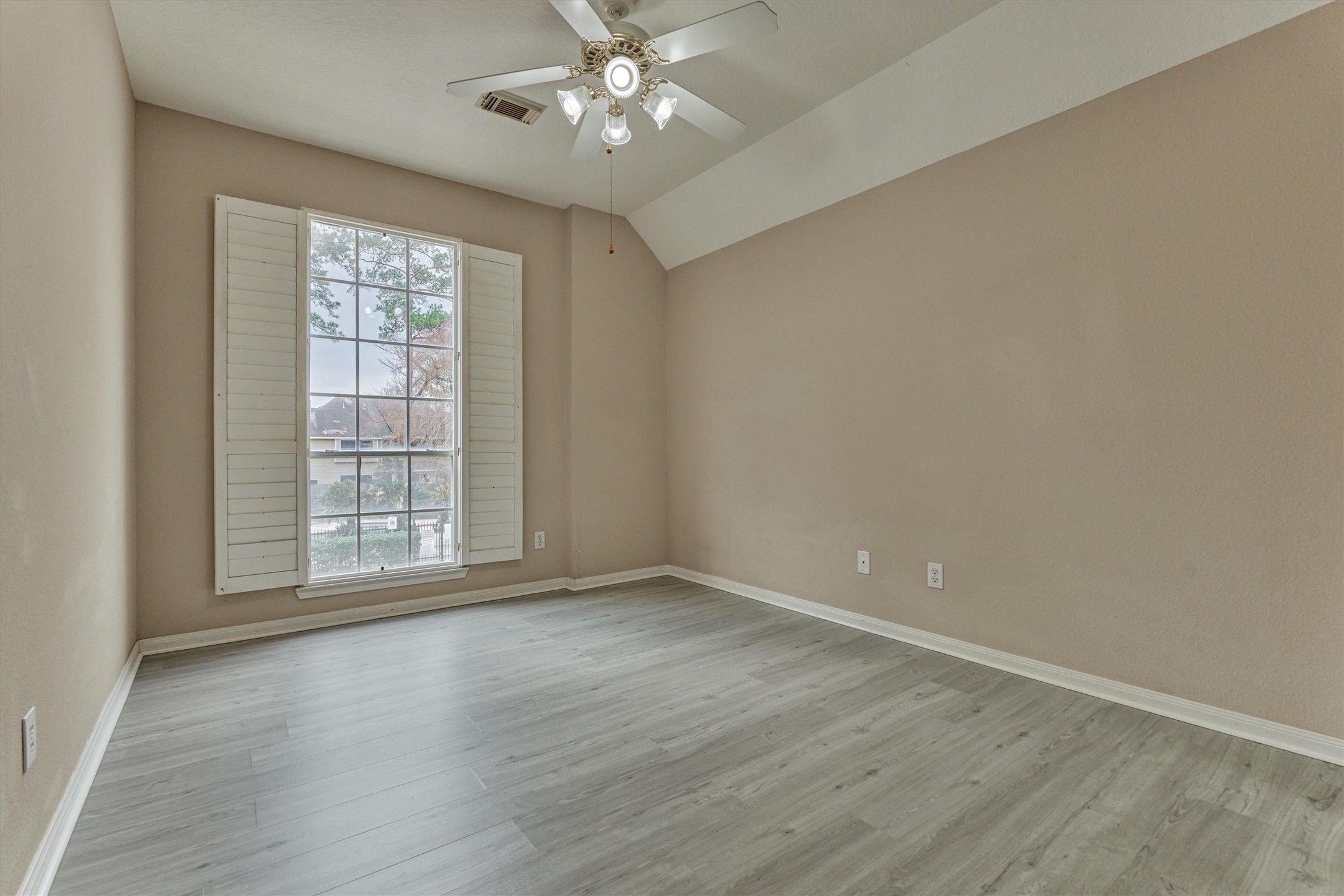 14420 Walters Road, Unit 26 Houston, TX 77014 - Photo 34 of 45 wooden floor in an empty room with a window