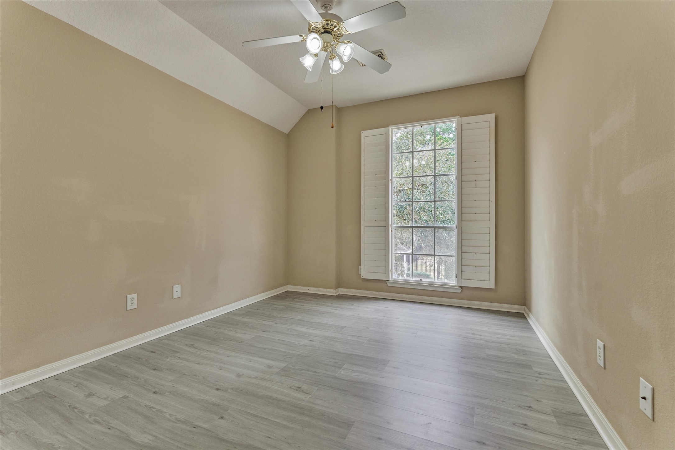 14420 Walters Road, Unit 26 Houston, TX 77014 - Photo 37 of 45 a view of an empty room with window and wooden floor