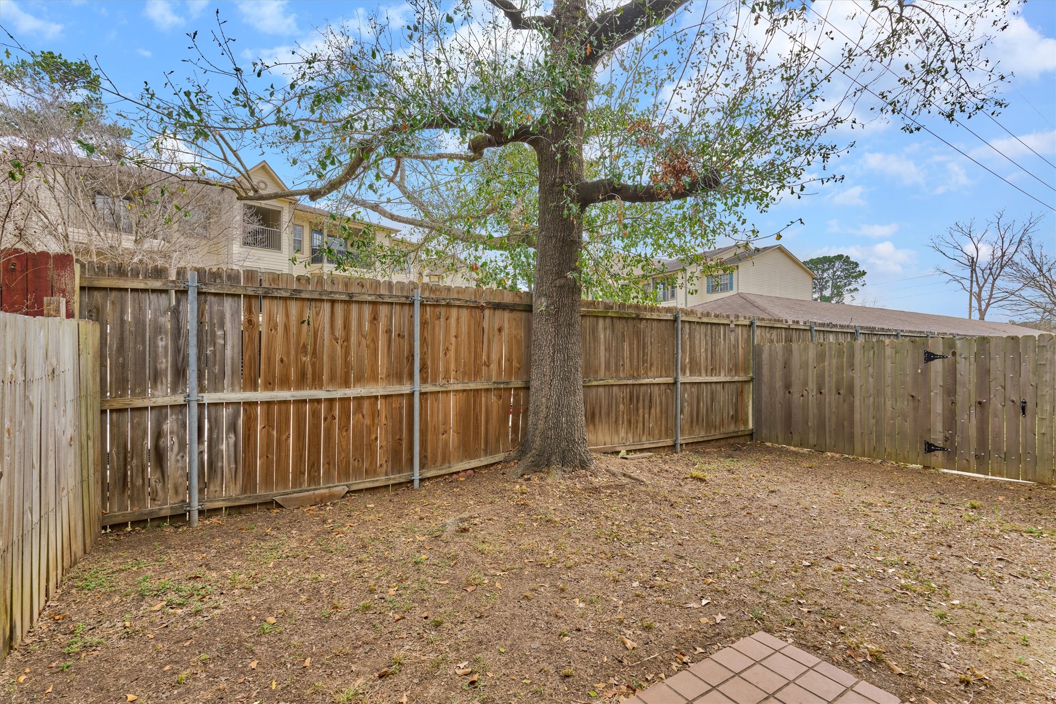 14420 Walters Road, Unit 26 Houston, TX 77014 - Photo 39 of 45 a view of backyard with wooden fence