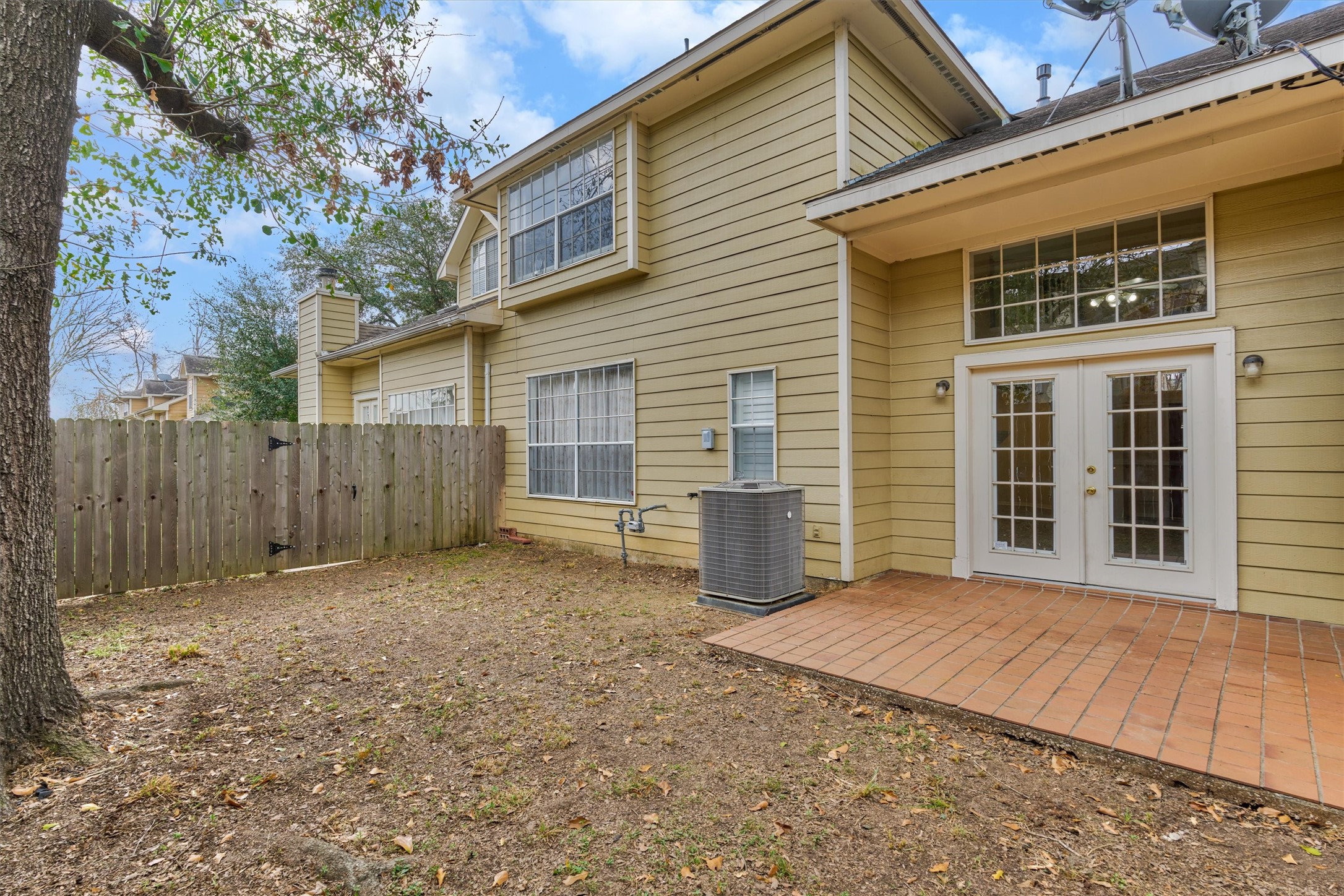 14420 Walters Road, Unit 26 Houston, TX 77014 - Photo 42 of 45 a view of backyard of house with wooden fence