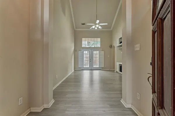a kitchen with white cabinets a sink and appliances