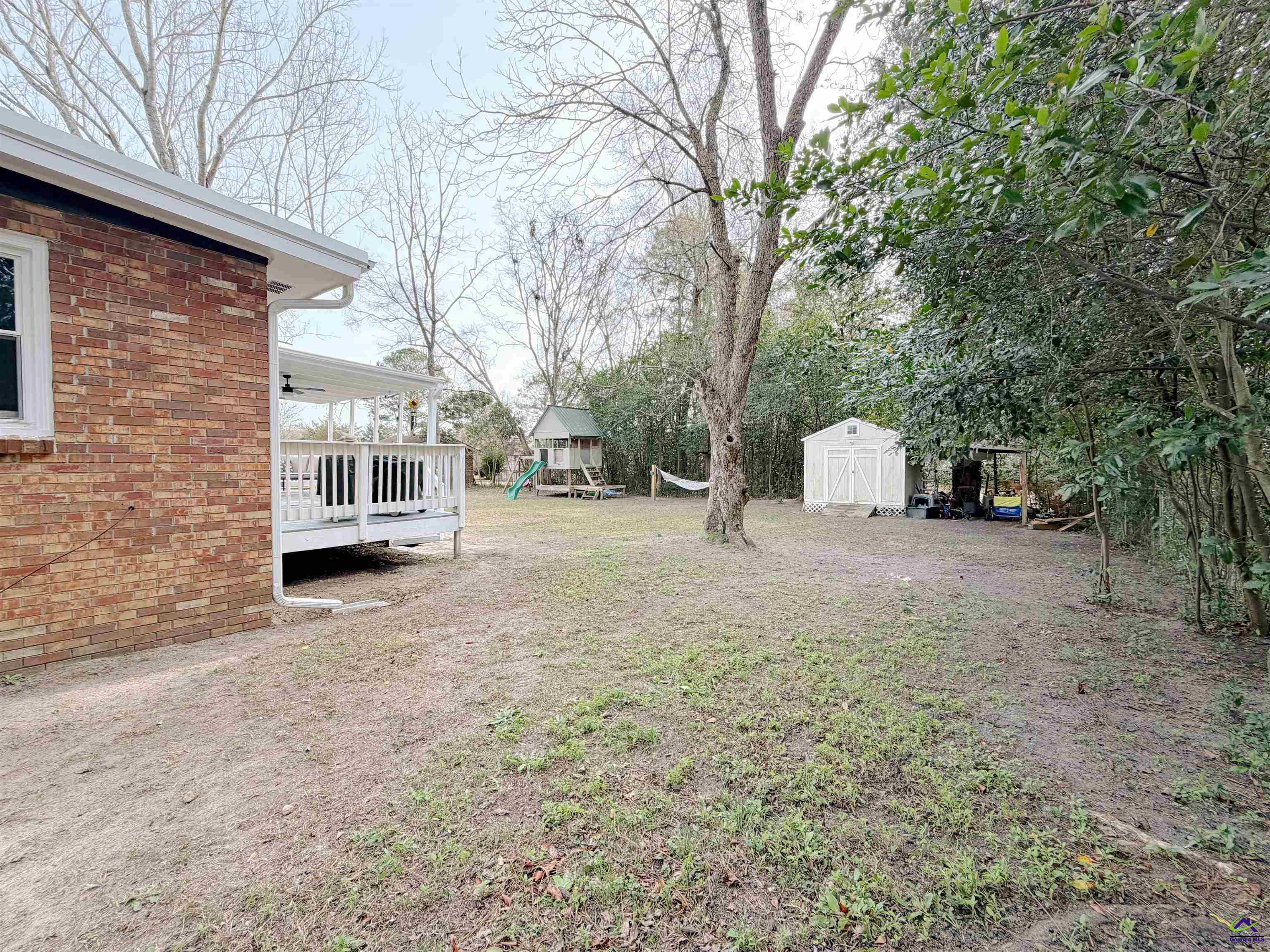 108 Weaver Road Warner Robins, GA 31093 - Photo 26 of 26 a view of a backyard with large trees