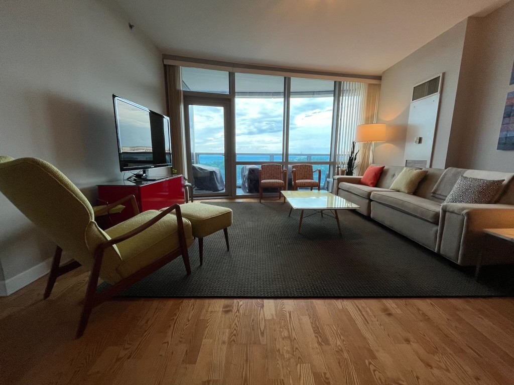 Undisclosed Address Chicago, IL 60605 - Photo 3 of 35 a living room with furniture and large windows