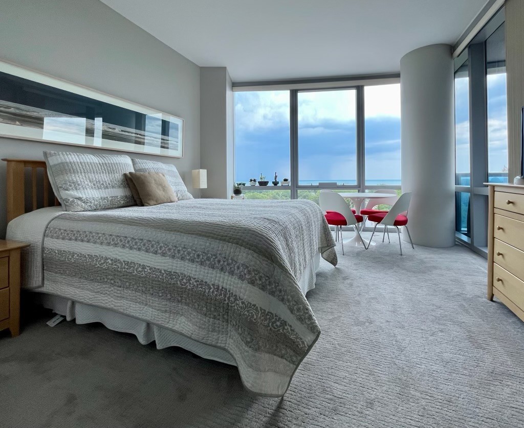 Undisclosed Address Chicago, IL 60605 - Photo 9 of 35 a bed sitting in a bedroom next to a window