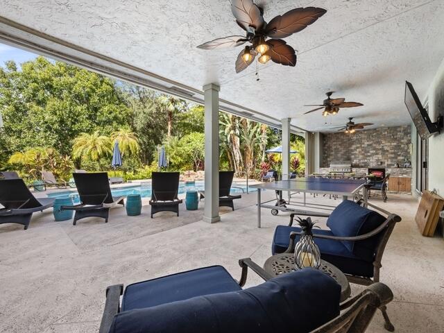 14767 Halter Road Wellington, FL 33414 - Photo 16 of 46 Outdoor Kitchen and Pool area