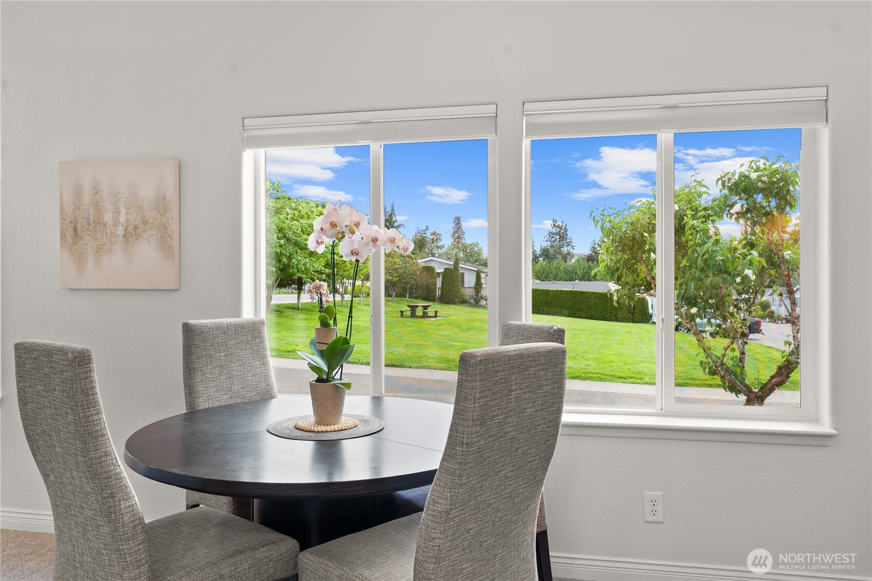 23825 15th Avenue Southeast, Unit 427 Bothell, WA 98021 - Photo 5 of 38 a dining room with a glass table and a floor to ceiling window