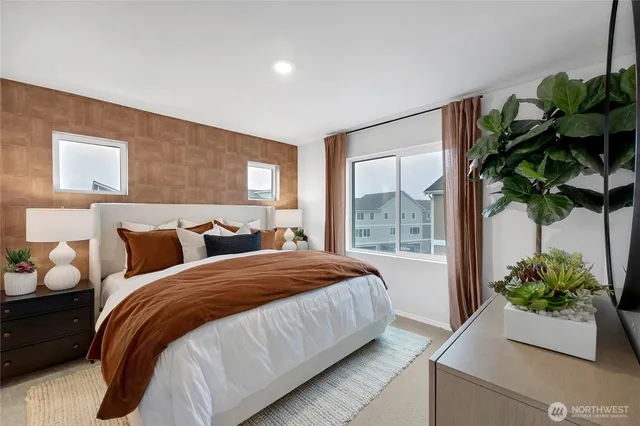 a bedroom with bed and cabinets