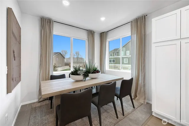a bedroom with bed and a potted plant