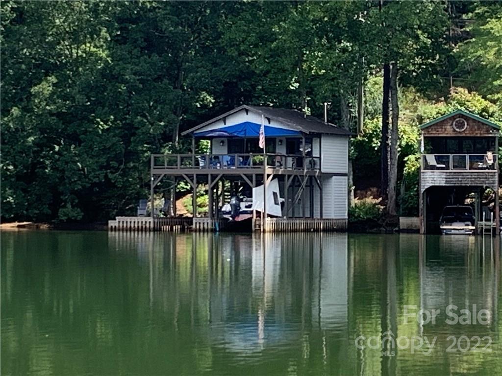 100 North Lake Summit Road Zirconia, NC 28790 - Photo 1 of 10 a backyard of a house with yard table and chairs