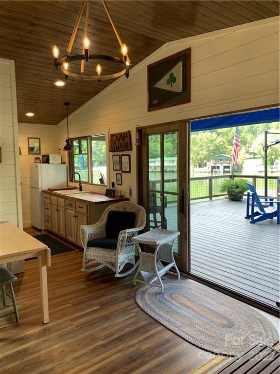 100 North Lake Summit Road Zirconia, NC 28790 - Photo 3 of 10 a living room with furniture wooden floor and windows