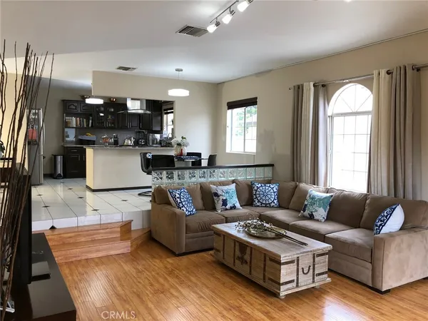 a living room with furniture and a large window