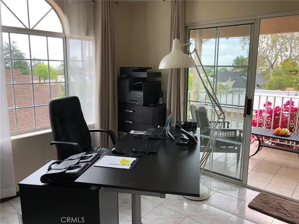 a dining room with table and chairs