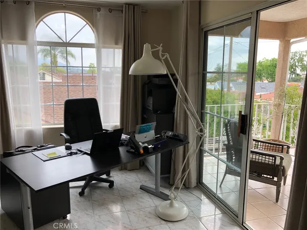 a view of workspace with a window and gym equipment