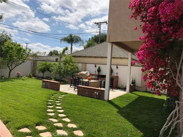 a view of a house with a yard porch and sitting area