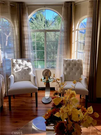 a living room with furniture and a large window