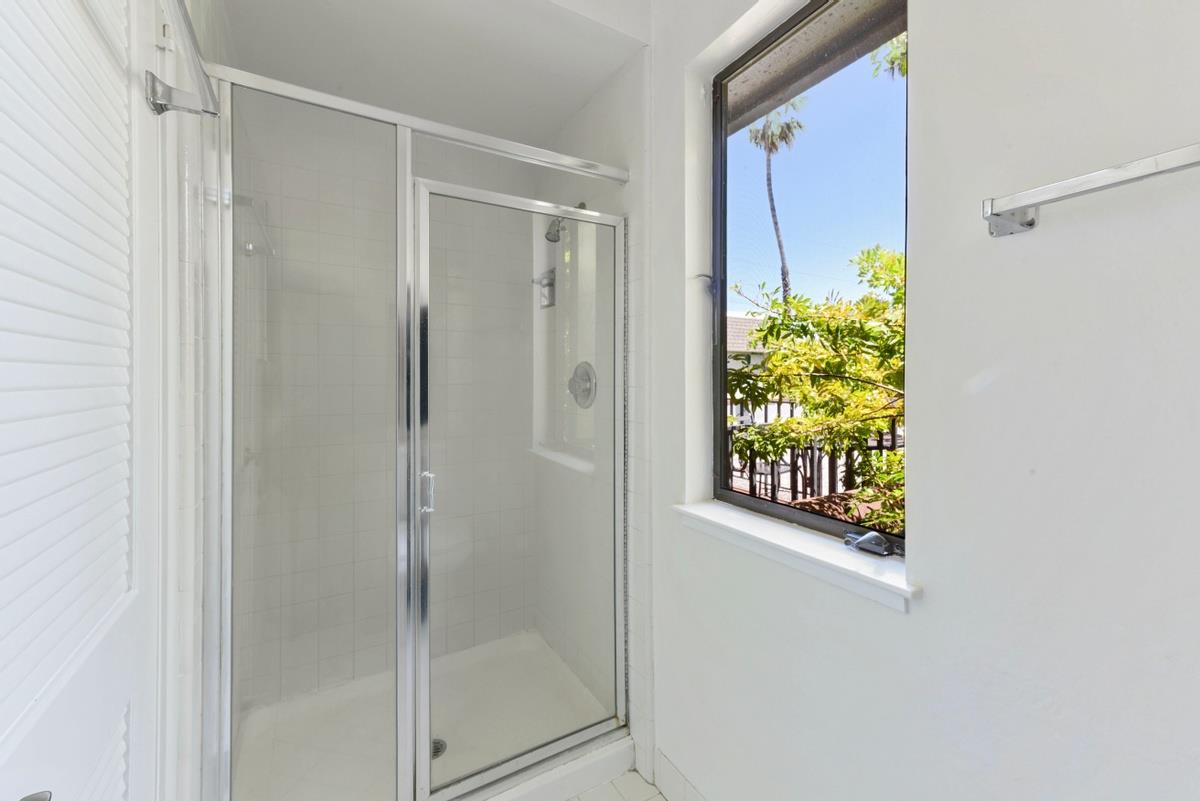 41 15th Avenue San Mateo, CA 94402 - Photo 11 of 11 a bathroom with a shower and a window