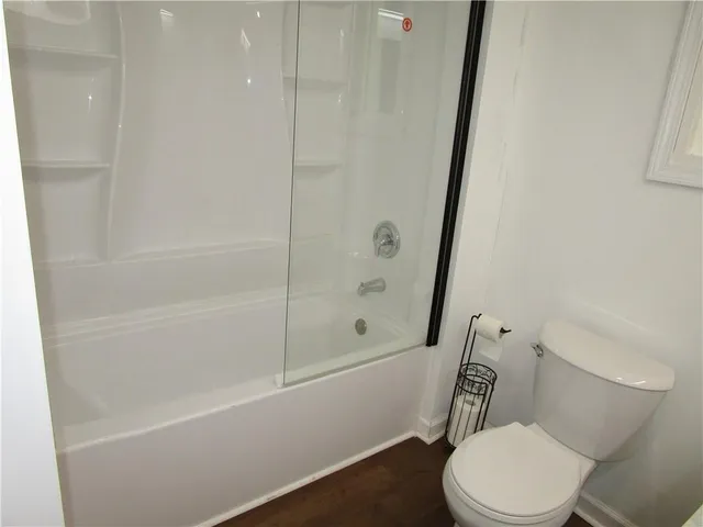 a bathroom with vanity and mirror