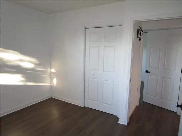 a small space with a window and a fan