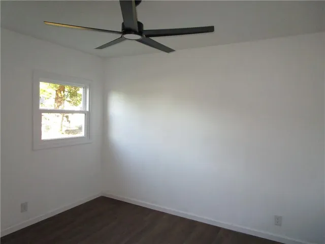 a view of a room with a wooden wall
