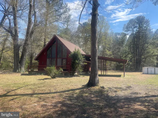 a view of a yard with snow on the road