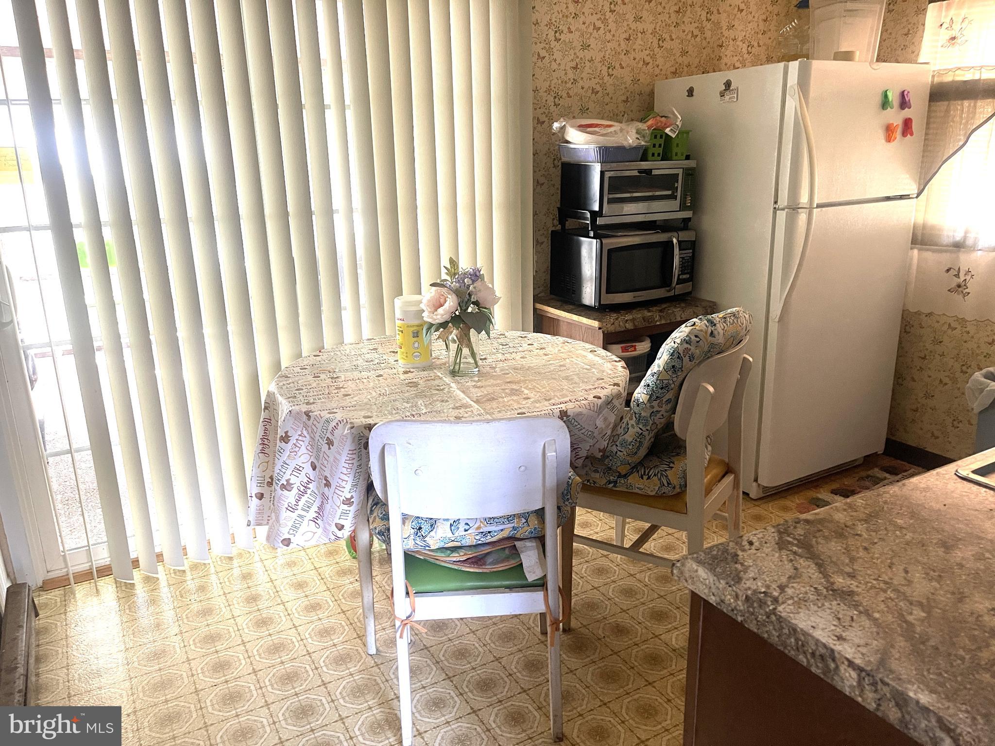 272 North Glebe Road Montross, VA 22520 - Photo 13 of 20 a dining room with furniture and a kitchen view