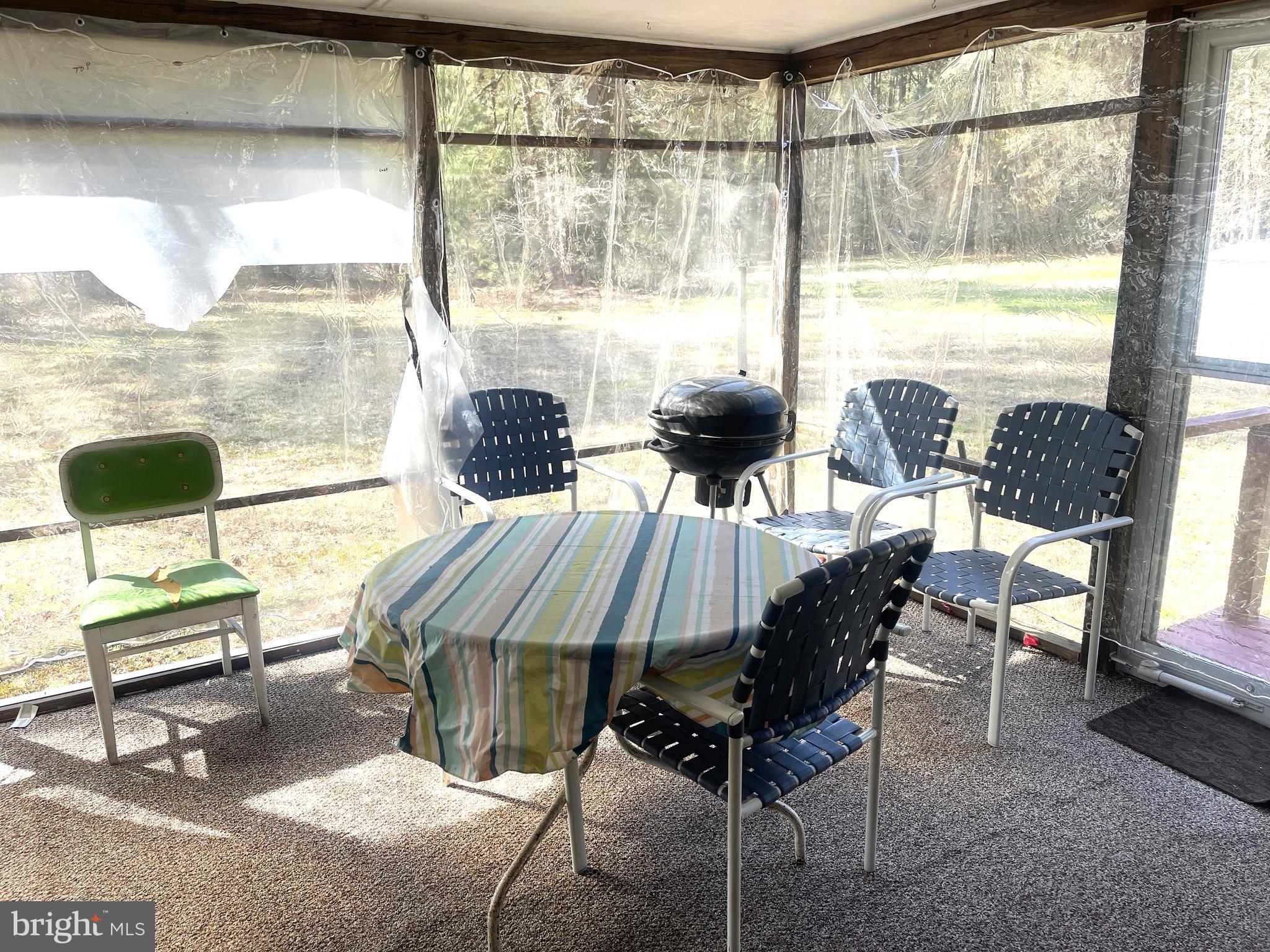 272 North Glebe Road Montross, VA 22520 - Photo 15 of 20 a dining room with furniture and a floor to ceiling window