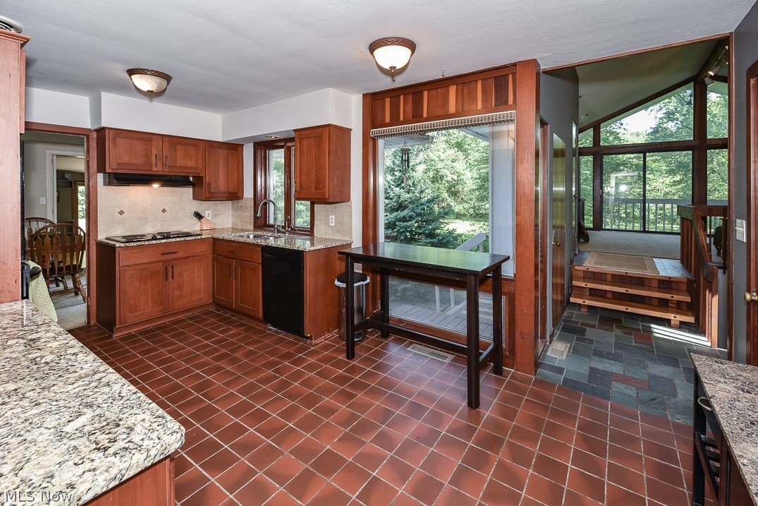30749 Jackson Road Chagrin Falls, OH 44022 - Photo 9 of 29 Kitchen with granite counter tops, tile flooring, large pantry, and access to outside