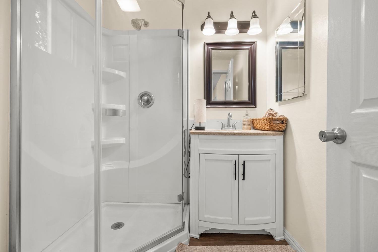 385 Burnham Road Oak View, CA 93022 - Photo 21 of 25 a bathroom with a shower a sink and a mirror