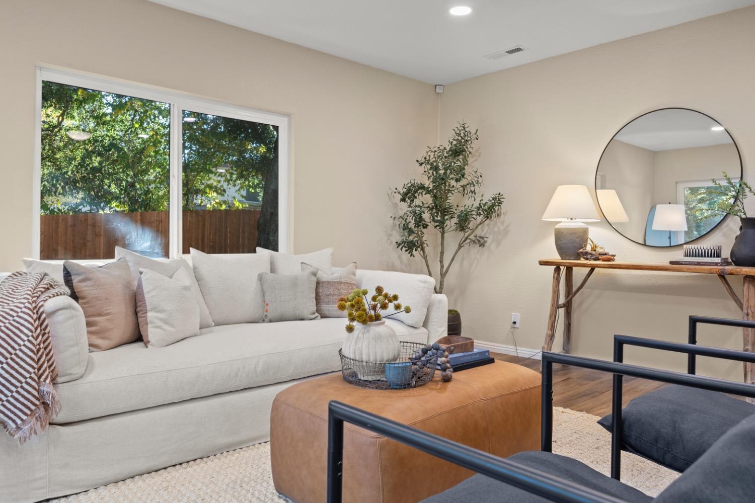 385 Burnham Road Oak View, CA 93022 - Photo 3 of 25 a living room with furniture and a potted plant