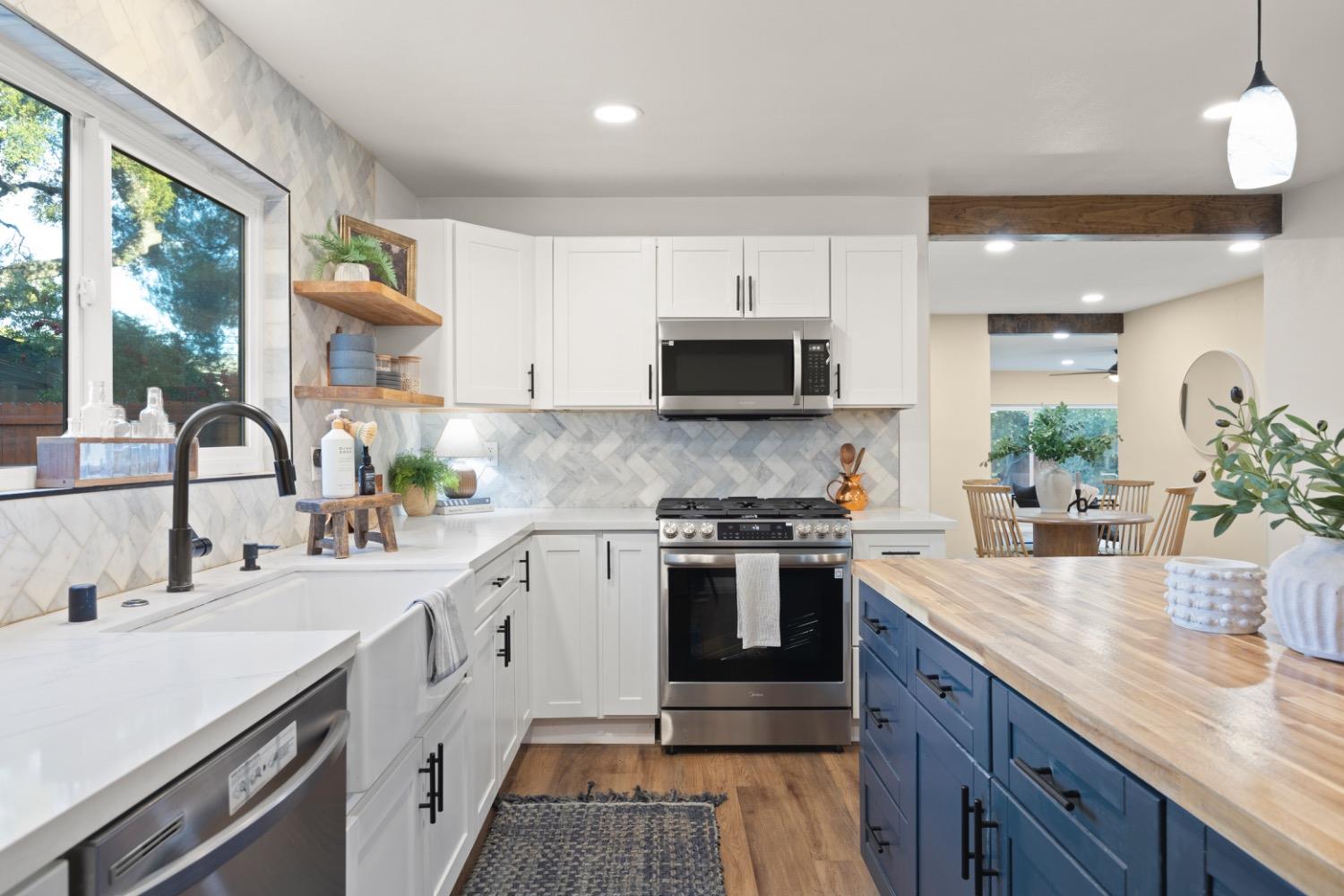 385 Burnham Road Oak View, CA 93022 - Photo 5 of 25 a kitchen with sink a stove and cabinets